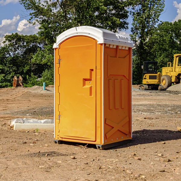 what is the cost difference between standard and deluxe porta potty rentals in Huxford